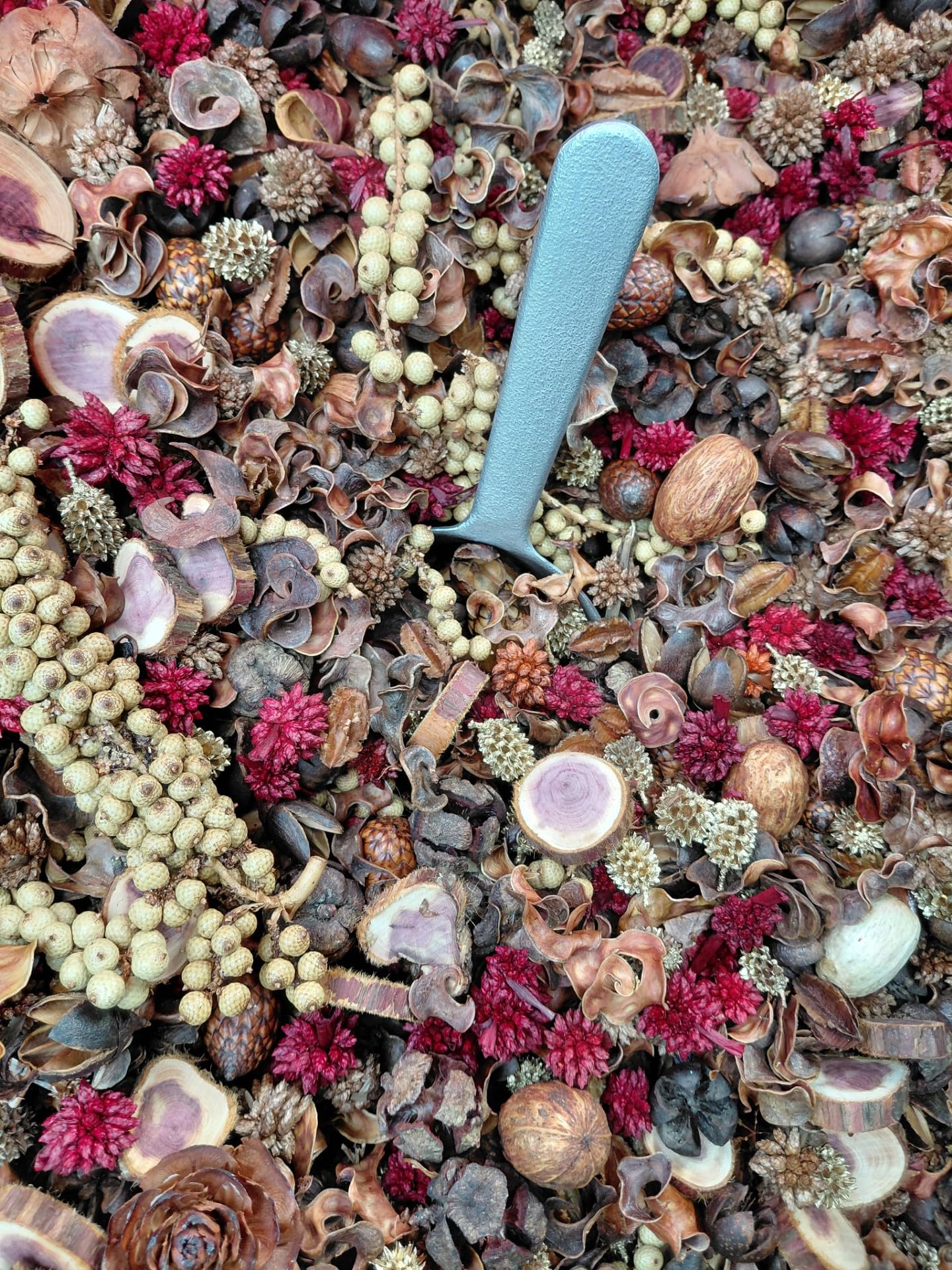 Handcrafted cedarwood potpourri with natural dried flowers and seeds in warm earthy tones