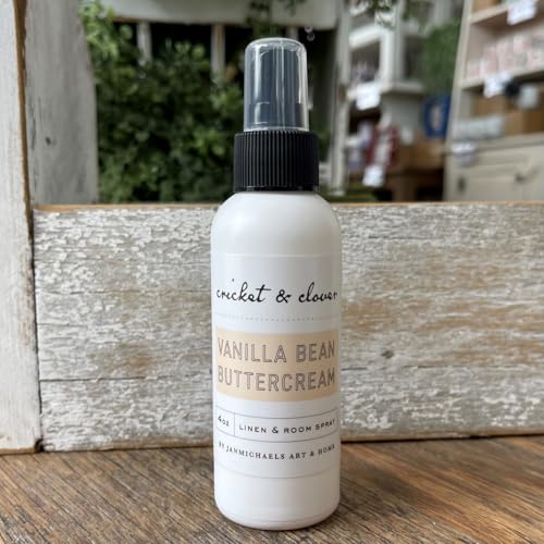 Cricket & Clover vanilla bean buttercream room spray in white bottle with black spray top on wooden surface