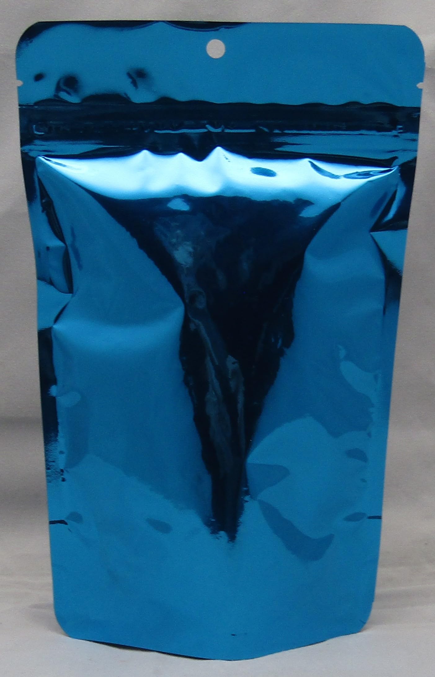Blue resealable bag containing herbal simmering potpourri for home fragrance by Shoots Roots and Leather Boots