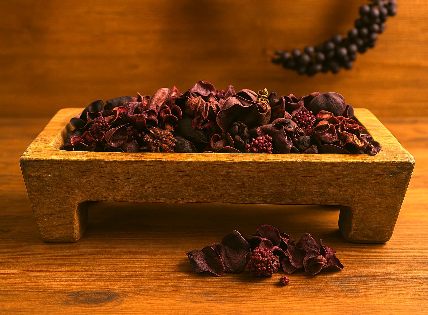 Bowl Filler Potpourri in a rectangular wooden container with dried red and brown floral elements