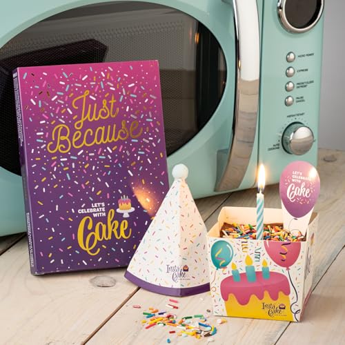 Instacake Cards cake in a card gift with birthday candle, party hat, and colorful sprinkles near microwave