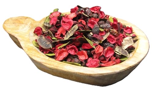 Potpourri for room fragrance in a wooden bowl with red and brown dried flower petals