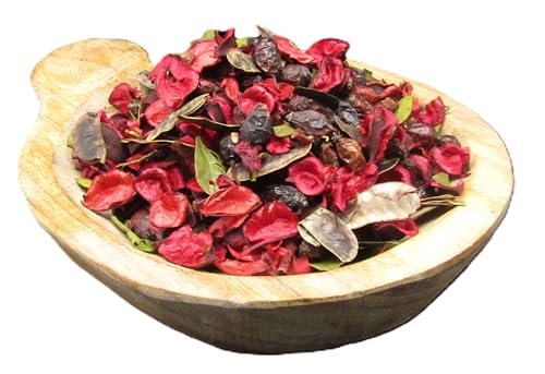 Potpourri for room fragrance with red and brown dried petals in a wooden bowl