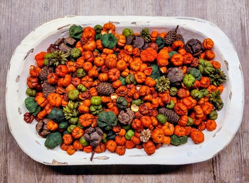 White distressed dough bowl filled with handmade potpourri rustic blend of orange and green mini pumpkins pine cones and pods