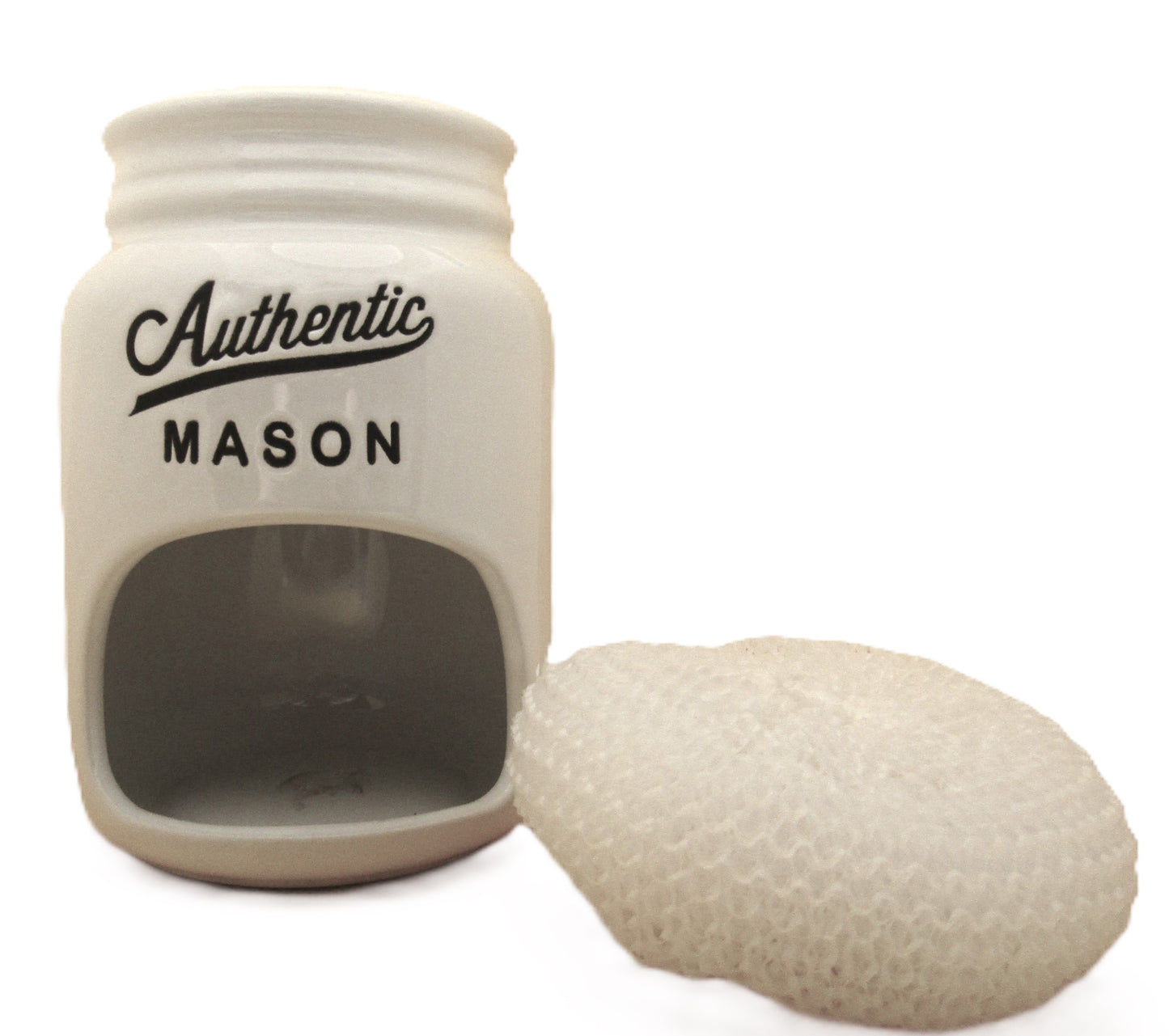 Home Essentials kitchen sink scrubby holder in white ceramic with black text and a white scrubby pad