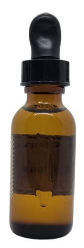 Amber glass bottle of orange spice potpourri refresher oil with a dropper for home fragrance