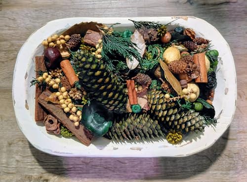 Spiced Pine Potpourri in white oval bowl with pine cones cinnamon sticks dried citrus and greenery