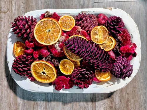 Cranberry Orange Potpourri in white wooden bowl with dried orange slices pine cones and red berries
