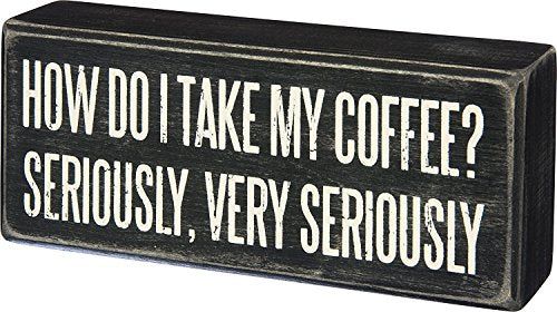 Wood box sign reading I Take My Coffee Very Seriously on a kitchen counter