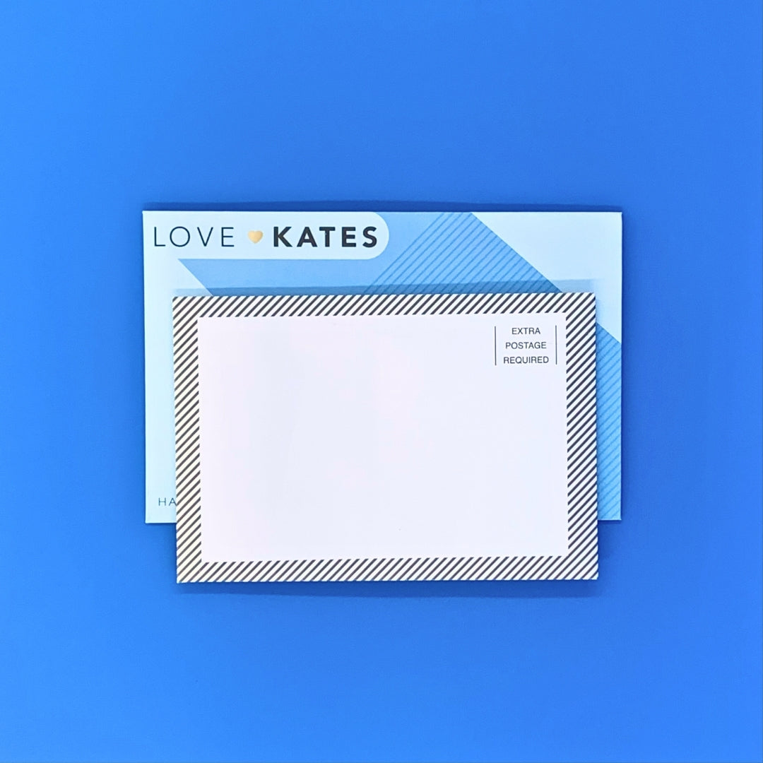 Note card with striped border and 'LOVE KATES' branding on a blue background