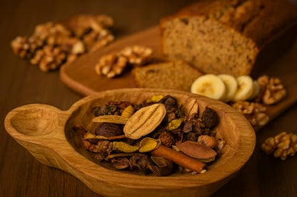 Shoots, Roots & Leather Boots potpourri with fragrant spices and dried fruits in a wooden bowl