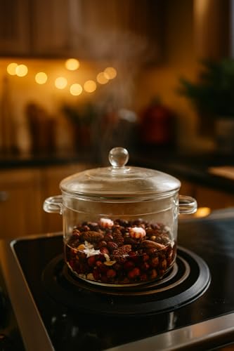 Glass pot with simmering ingredients releasing steam, infused with cafe latte simmer fragrance oil