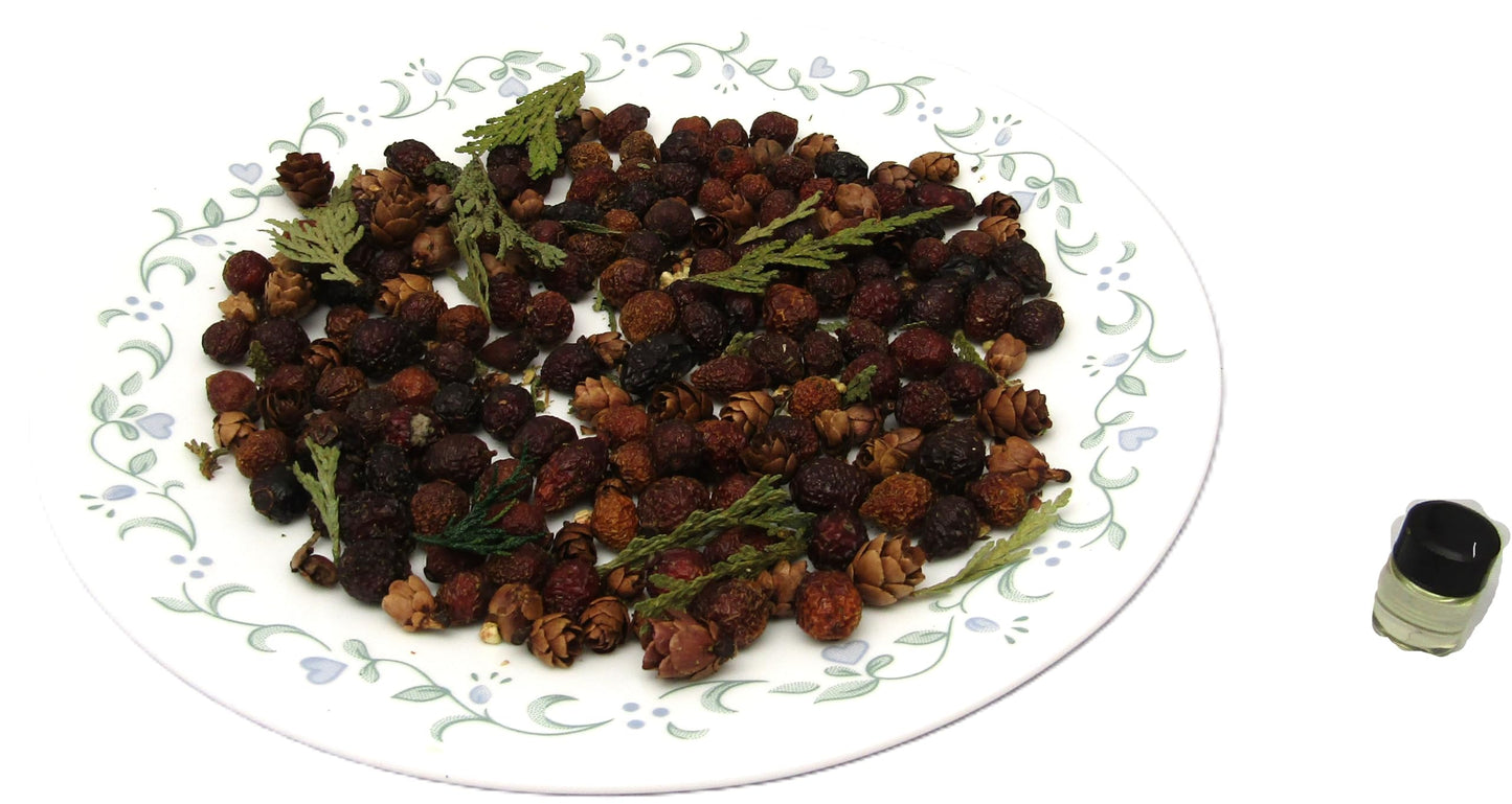 Cozy evergreens simmer potpourri arranged on a decorative plate with natural elements for home fragrance