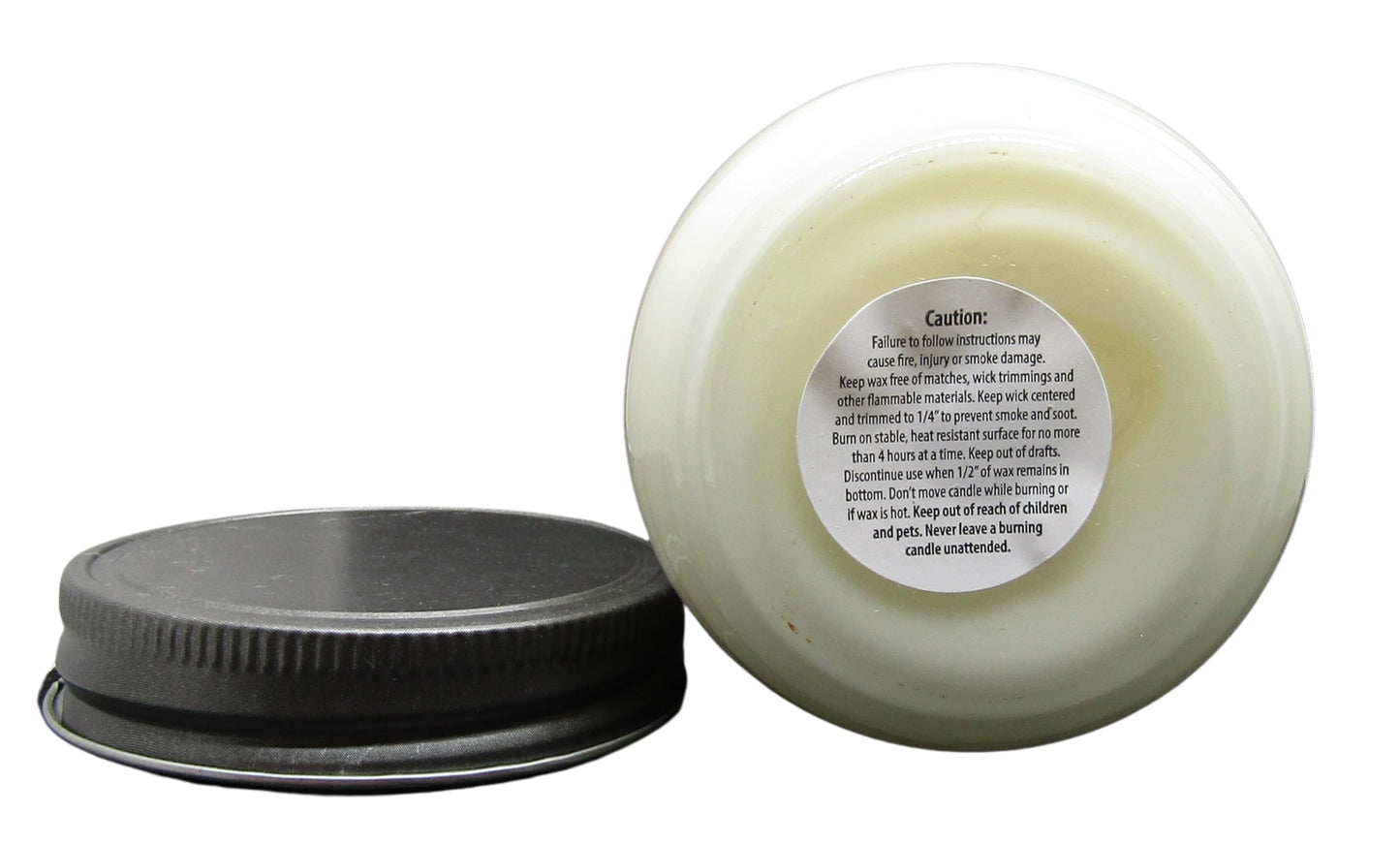 Cricket & Clover candle wax soy in white with caution label on the lid