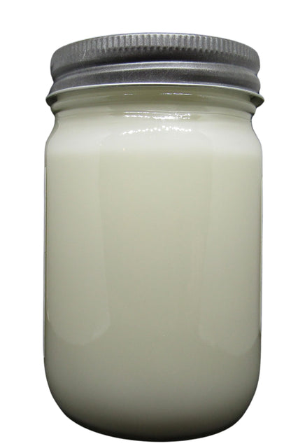 Cricket & Clover candle wax soy in a clear glass jar with a silver lid, perfect for home scenting.