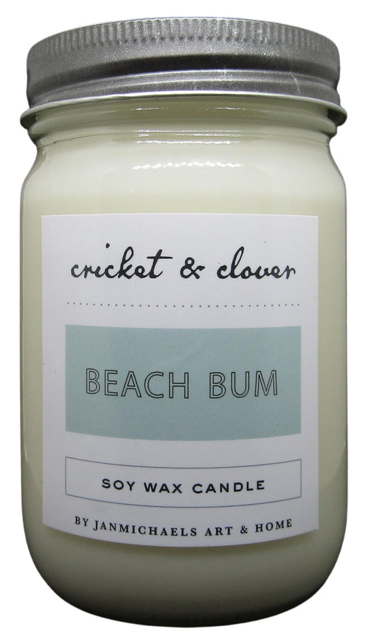 Cricket & Clover Beach Bum candle wax soy in a white jar with a silver lid for a refreshing scent