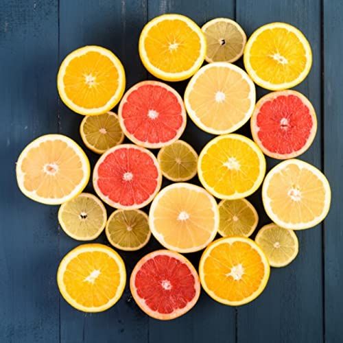 Cricket and Clover potpourri with sliced citrus halves on dark wood for citron and mandarin room spray scent