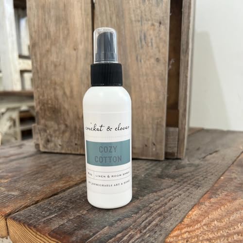 Cricket and Clover Cozy Cotton Room Spray bottle on rustic wooden surface for linens and rooms