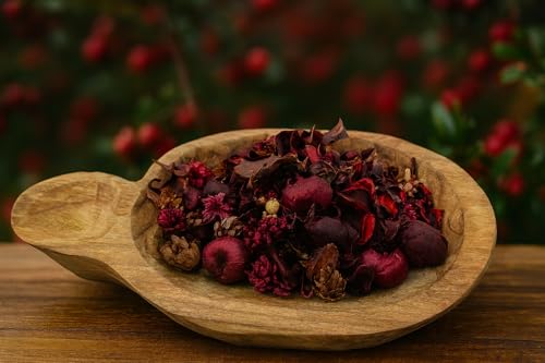Natural cranberry potpourri refresher oil spray displayed in a wooden bowl, enhancing home fragrance