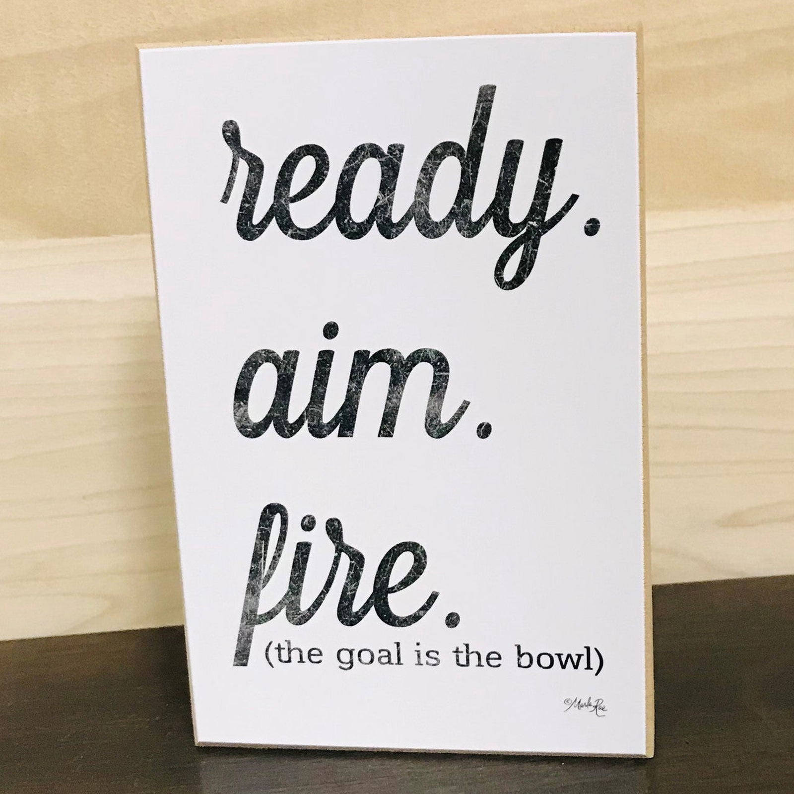 Ready Aim Fire Bathroom Sign featuring the phrase the goal is the bowl for home decor