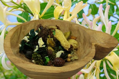 Honeysuckle potpourri bowl filler displayed in a rustic wooden bowl with assorted natural elements