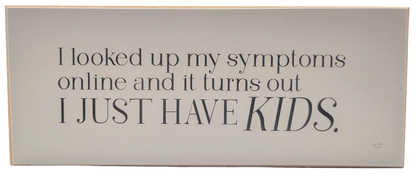 Humorous parenting quote sign by Jan Michaels Art with the text about kids as symptoms