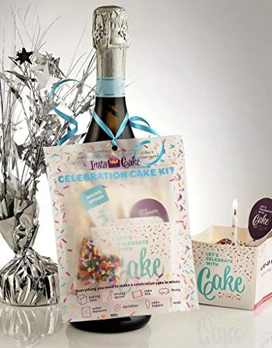 Instacake Cards celebration cake kit hanging on champagne bottle with confetti decor and candle party favor cake kit for events
