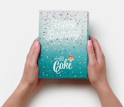 Hands holding a unique birthday gift card with colorful sprinkles and Happy Birthday text