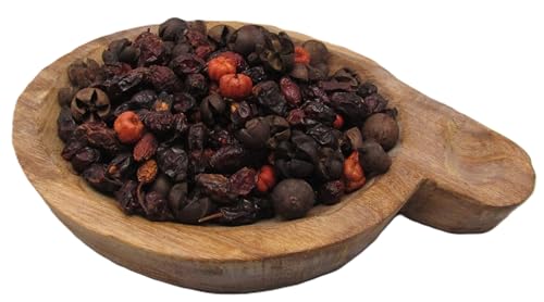 Fall home decor potpourri with dried berries and nuts in a wooden bowl by Just Browsing
