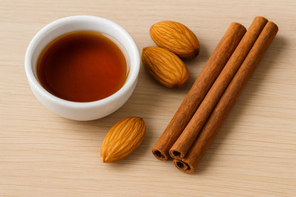Maple almond cinnamon home fragrance with cinnamon sticks and almonds in a bowl