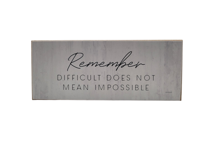 Inspirational motivational wood block sign featuring the quote Remember, Difficult Does Not Mean Impossible