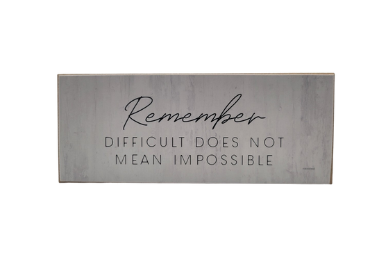 Inspirational motivational wood block sign featuring the quote Remember, Difficult Does Not Mean Impossible
