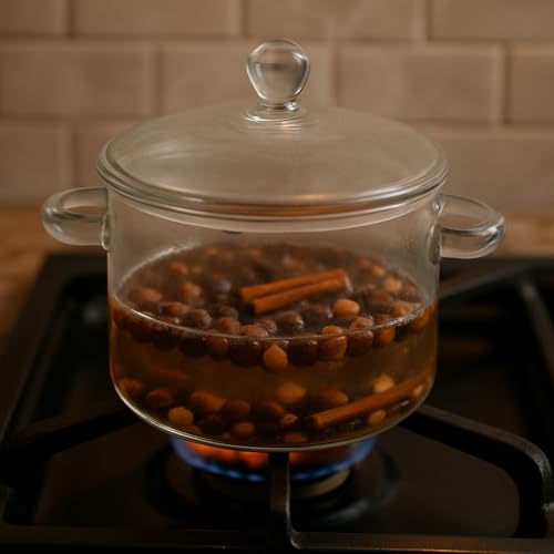 Clear glass simmer pot with nutty vanilla simmer pot oil and spices on the stove