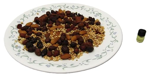 Nutty vanilla simmer potpourri on a white plate with assorted nuts, spices, and fragrance oil for home decoration.