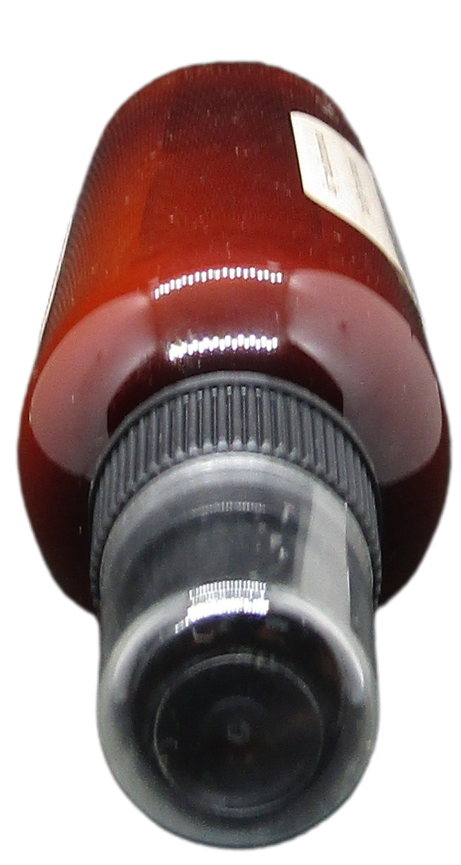 Brown bottle with black spray cap containing autumn room spray for home by Old Candle Barn