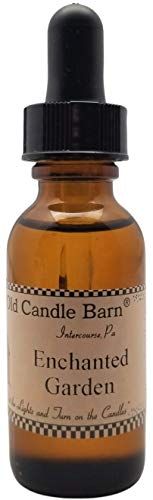 Old Candle Barn Enchanted Garden refresher oil in amber bottle for enhancing potpourri fragrance