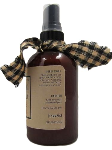 spiced orange room spray in amber bottle with black spray top and gingham ribbon bow
