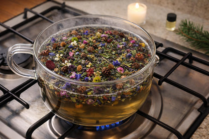 Shoots, Roots & Leather Boots Sweet Annies Garden Simmer Potpourri in a clear glass pot with colorful herbs