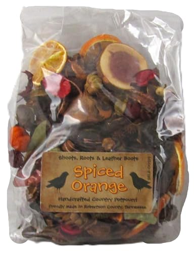 Clear plastic bag of Spiced Orange Potpourri with dried orange slices red petals and cinnamon pieces for home