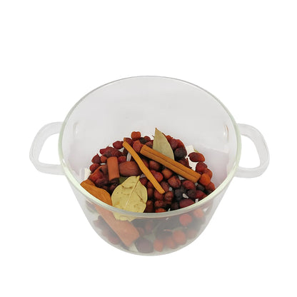 Spiced cranberry simmer potpourri mix in a clear glass pot for festive home fragrance