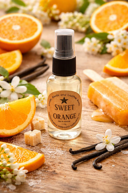 Shoots, Roots & Leather Boots Sweet Orange Potpourri Refresher Oil in a spray bottle surrounded by orange slices and flowers