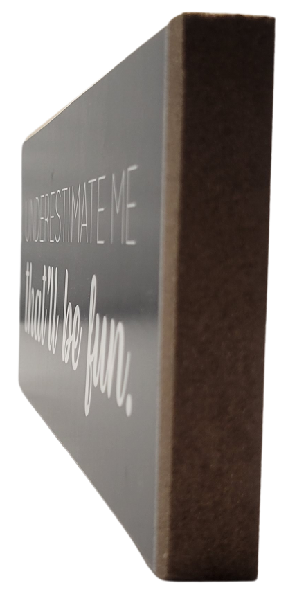 Jan Michaels Art & Home wooden underestimate me that will be fun sign with white text on black background