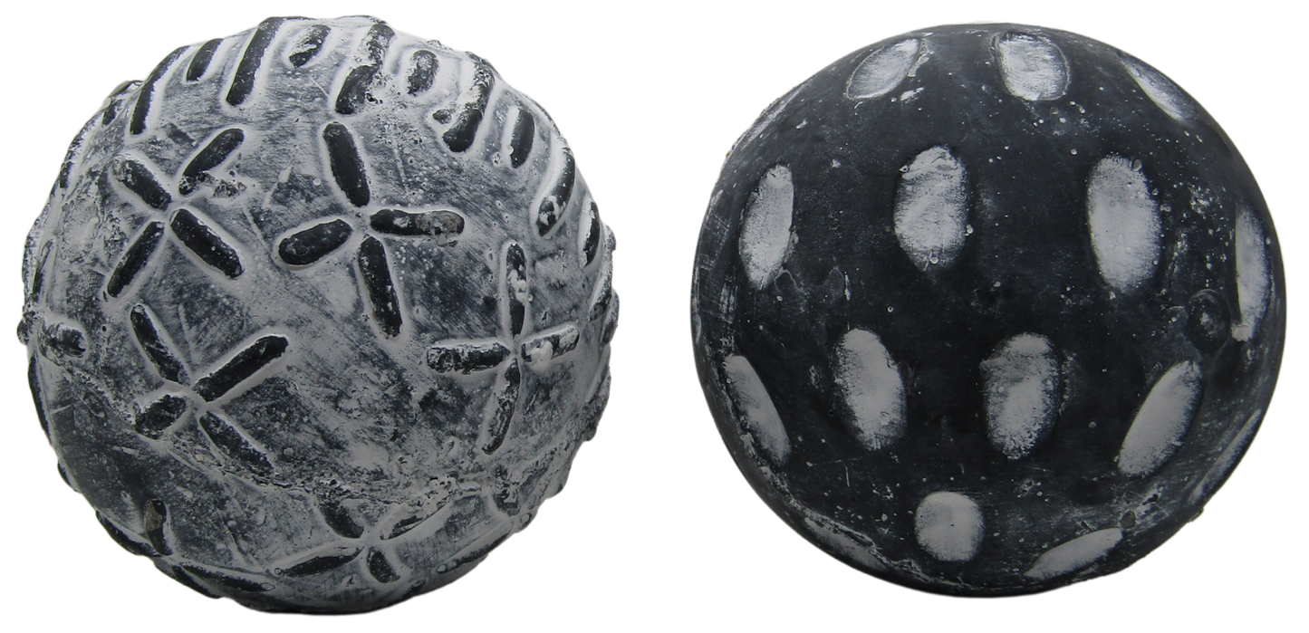 Two textured black and gray concrete garden spheres set decorative outdoor yard and patio accents