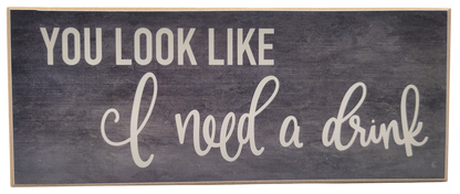 Jan Michaels Art & Home wooden wall sign with the phrase you look like i need a drink in white lettering