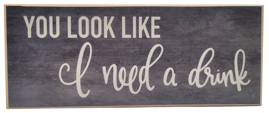 Jan Michaels Art & Home wooden wall sign with the phrase you look like i need a drink in white lettering