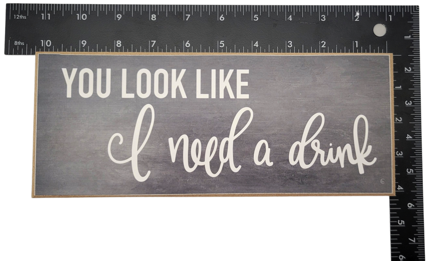 You look like i need a drink sign with white text on gray wooden home decor by Jan Michaels Art & Home