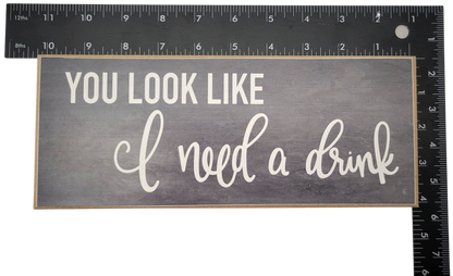 You look like i need a drink sign with white text on gray wooden home decor by Jan Michaels Art & Home